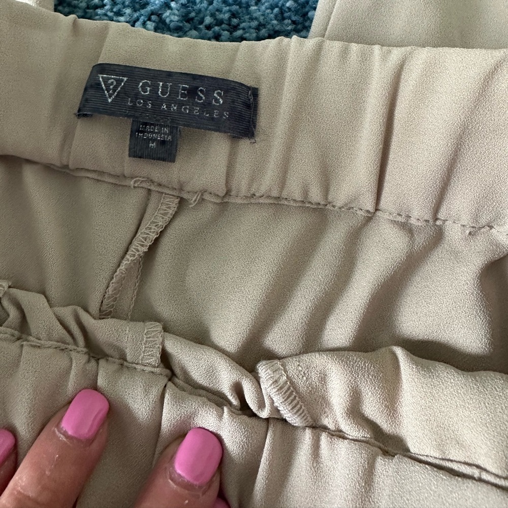 Guess Beige cargo pants.  New  with black stripes on sides
